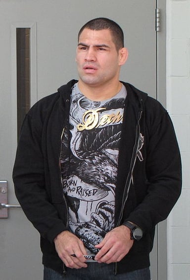 What charges was Cain Velasquez facing in March 2022?