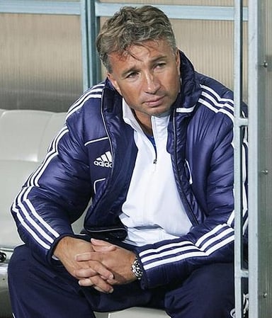 With which team did Petrescu earn his first head coach job?