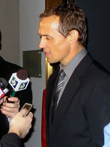 How many games did Yzerman dress as captain for the Red Wings?