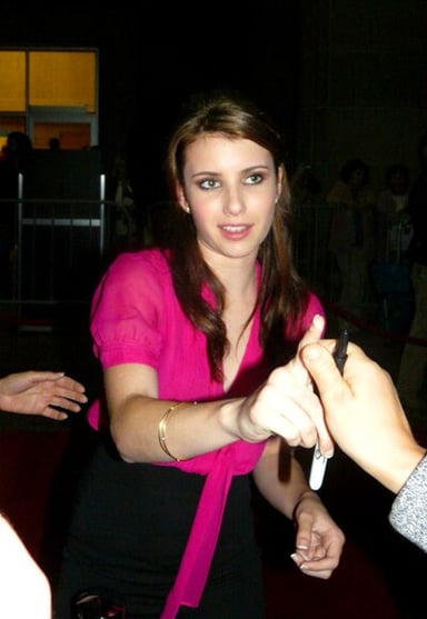 In which horror film series did Emma Roberts play a starring role?