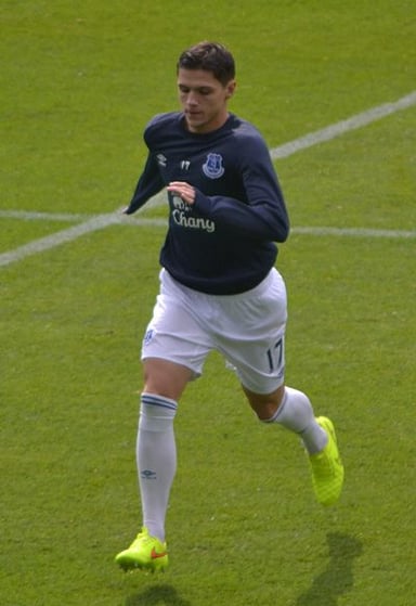 Against which team did Bešić make his senior international debut?