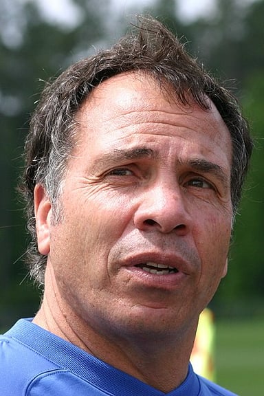 What position did Bruce Arena play in college soccer?