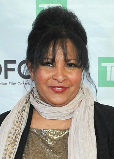 Pam Grier's character teams up with a bounty hunter in which film?