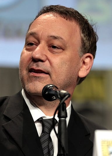 Which superhero trilogy did Sam Raimi direct in the early 2000s?