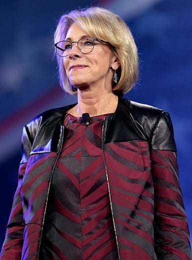 What educational organization did Betsy DeVos serve on the board of?