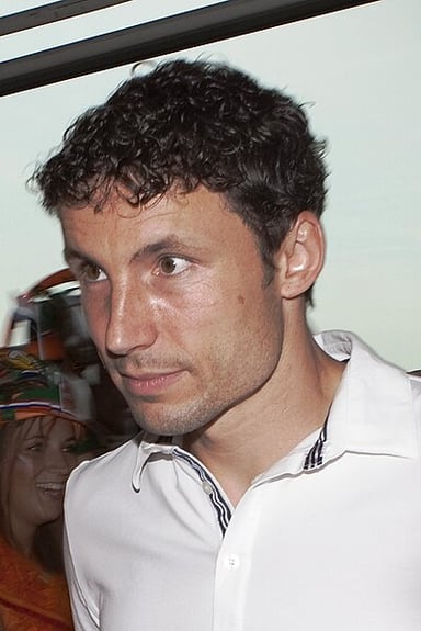 Which World Cup described van Bommel as a "tackling machine and expert ball-winner"?