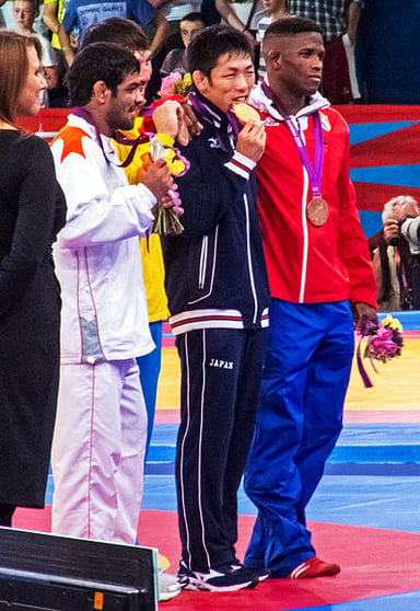 In which country were the 2012 Olympics, where Sushil carried the flag, held?