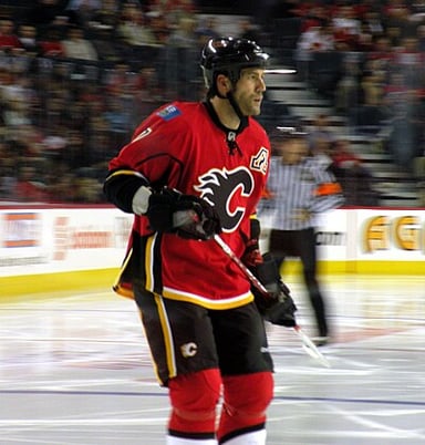 Which coach did Bertuzzi play under during his first season with the Canucks?