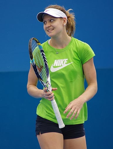 Who did Lucie Šafářová play alongside to win her Grand Slam doubles titles?