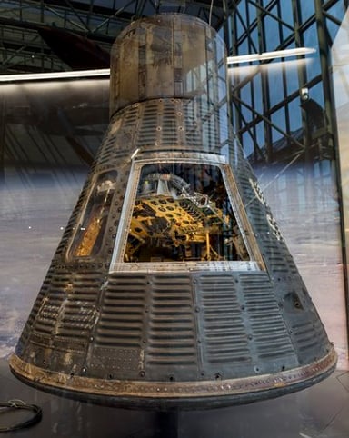 Which collection or museum includes John Glenn's work?