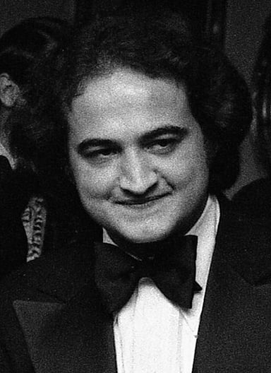 What was the name of the comedy troupe John Belushi started?