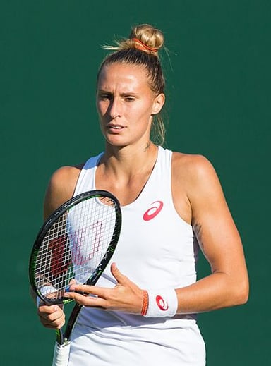 Who did Polona Hercog partner with to win junior doubles titles in 2008?