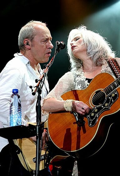 Has Emmylou Harris ever been involved in music outside of the country genre?