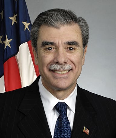 Which U.S. President did Carlos Gutierrez serve under as Secretary of Commerce?