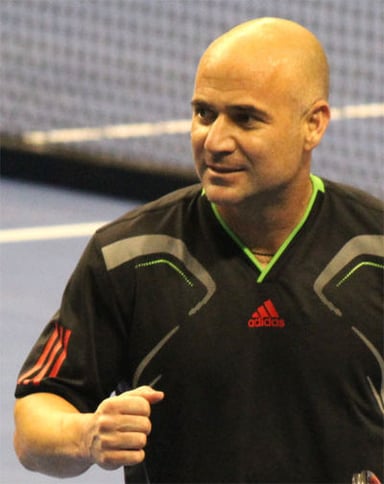 What is the most recent Grand Slam that an American man has won, which was won by Andre Agassi?