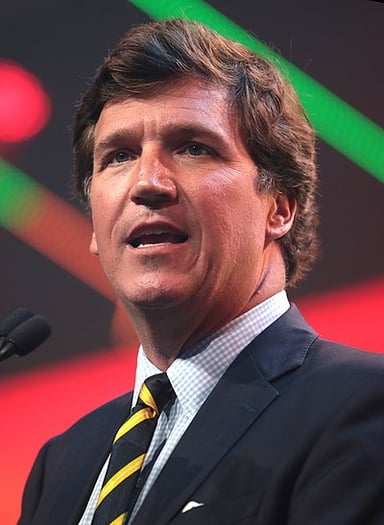 What political ideology is Tucker Carlson often associated with?