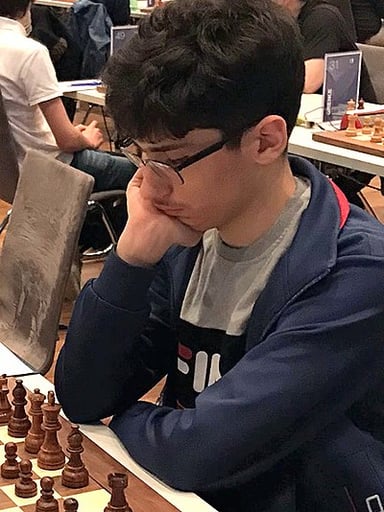 How young was Firouzja when he won the Iranian Chess Championship?