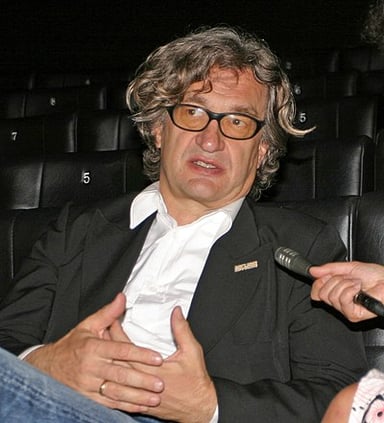 Wim Wenders’ films are primarily filmed in which language?