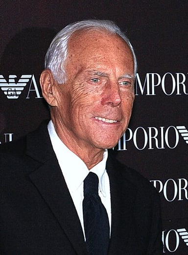 Which famous singer has Giorgio Armani collaborated with for tour costumes?