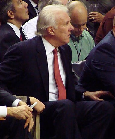 What position does Gregg Popovich hold in the San Antonio Spurs organization besides head coach?