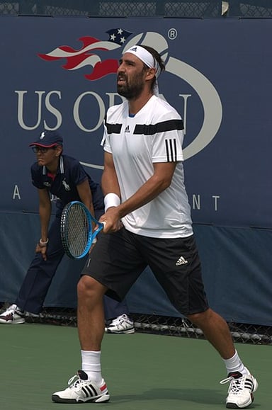 Which tennis academy did Baghdatis attend in his youth?