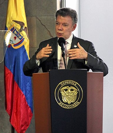 Which profession does Juan Manuel Santos hold aside from being a politician?