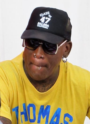 Which actress was Dennis Rodman briefly married to?