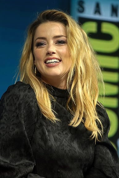 Which 2015 film did Amber Heard appear in with Eddie Redmayne?