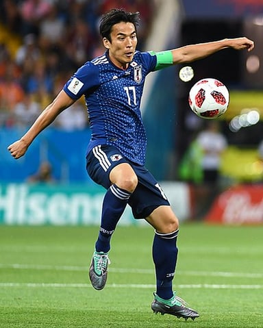 Which team did Makoto Hasebe score his first international goal against?