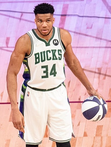 Who were the other players to win two MVPs before age 26 along with Giannis?