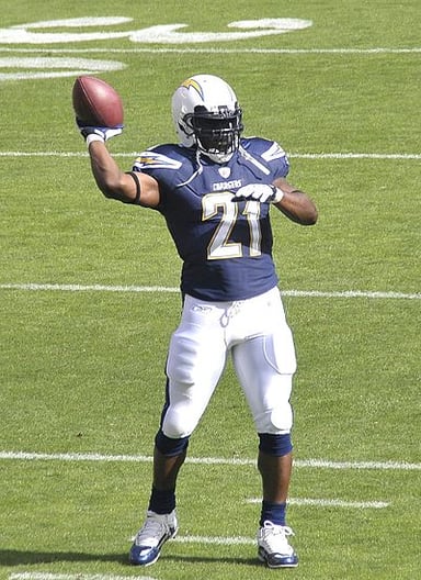 Which Chargers' jersey number was retired in honor of Tomlinson?