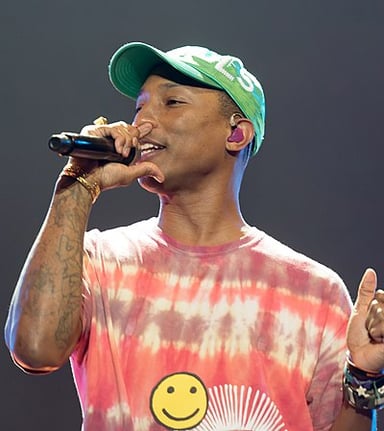 Which band did Pharrell feature on in 2013?