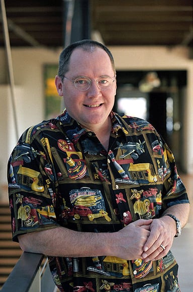 How much have John Lasseter's works grossed in total?