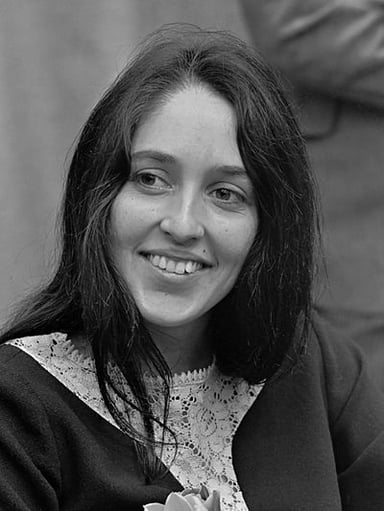 What is the primary genre of Joan Baez's music?