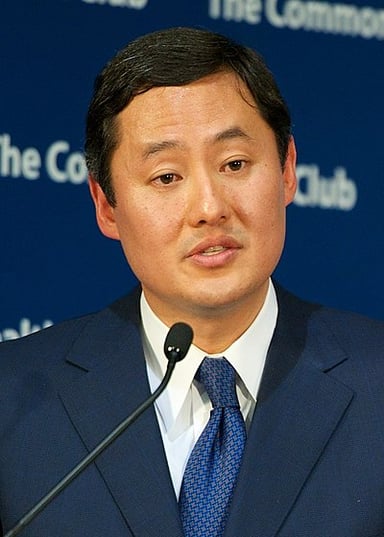 Which institution does John Yoo currently serve as a professor at?