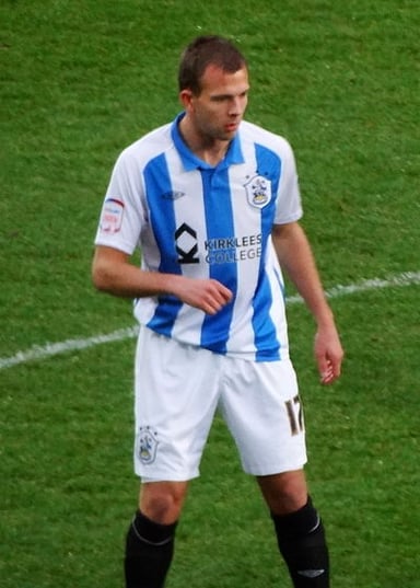 Who did Rhodes go on loan to from the Championship club Huddersfield Town?