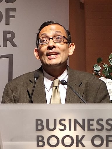 What position does Abhijit Banerjee hold in Massachusetts Institute of Technology?