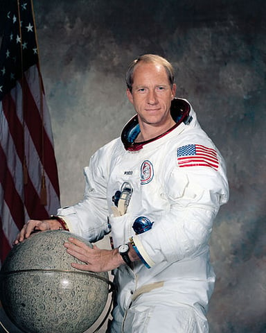 What was the command module's name in which Worden orbited the Moon?