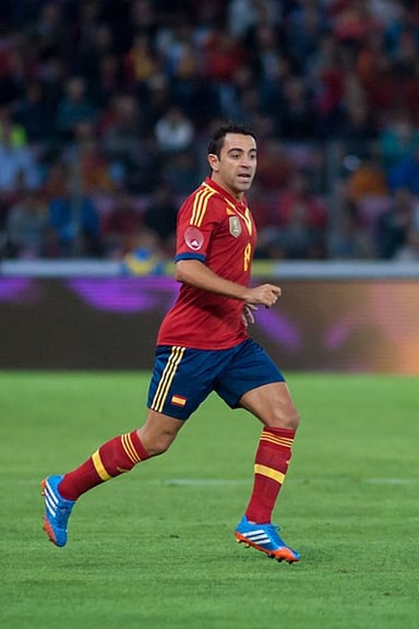 How many times was Xavi named the IFFHS World's Best Playmaker?