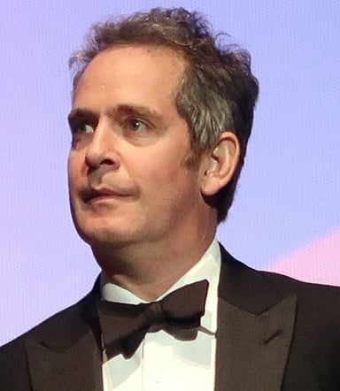 Which society was Tom Hollander president of?