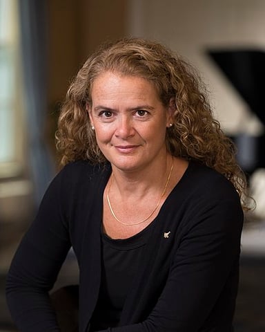 Which space shuttle did Julie Payette first fly on?