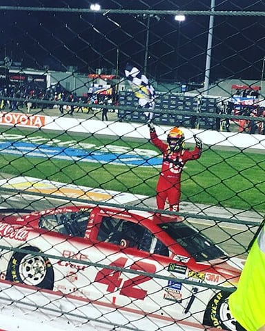 Which team did Kyle Larson win the 24 Hours of Daytona sports car race with in 2015?