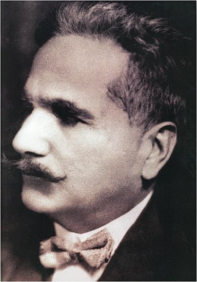 In which year did Iqbal deliver his presidential address at the All India Muslim League's annual meeting?