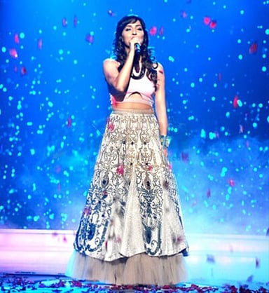 Which languages has Neeti Mohan sung songs in?