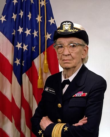 What organization did Grace Hopper consult for in the creation of a machine-independent programming language?