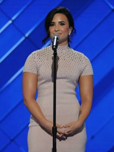 When did Demi Lovato receive the [url class="tippy_vc" href="#1813143"]Time 100[/url]?