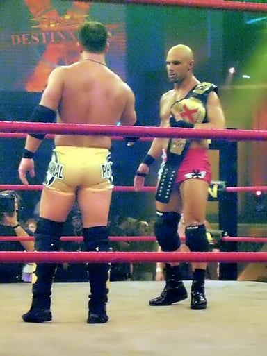 Christopher Daniels held the tag championship in what company?