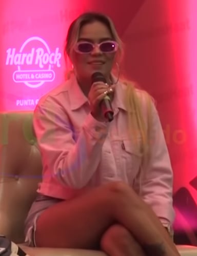 With which song did Karol G achieve her highest-charting single on Billboard Hot 100? 