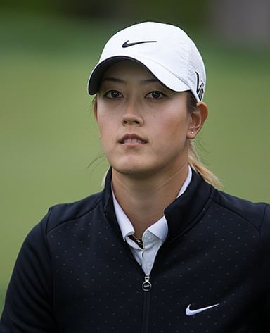 At what age did Michelle Wie West qualify for a USGA amateur championship?