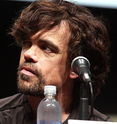 Which film set in the "The Hunger Games" universe features Dinklage?